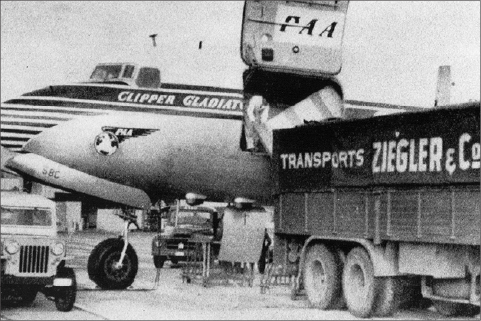 A Ziegler transporter vehicle loading goods into an aircraft
